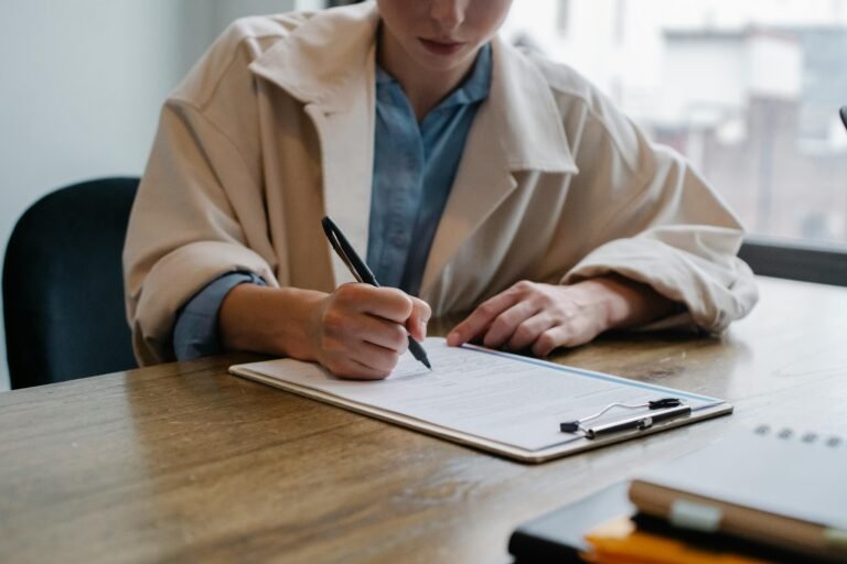 woman writing motivation letter